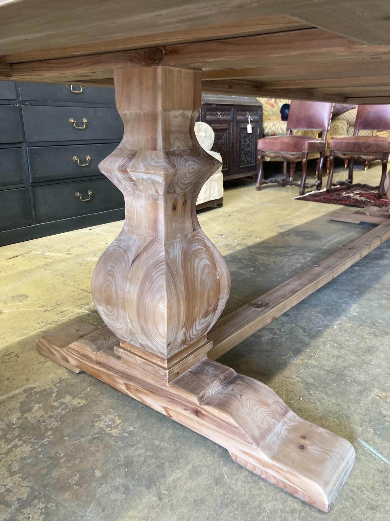 An 18th century style rectangular pine refectory dining table, length 300cm, depth 100cm